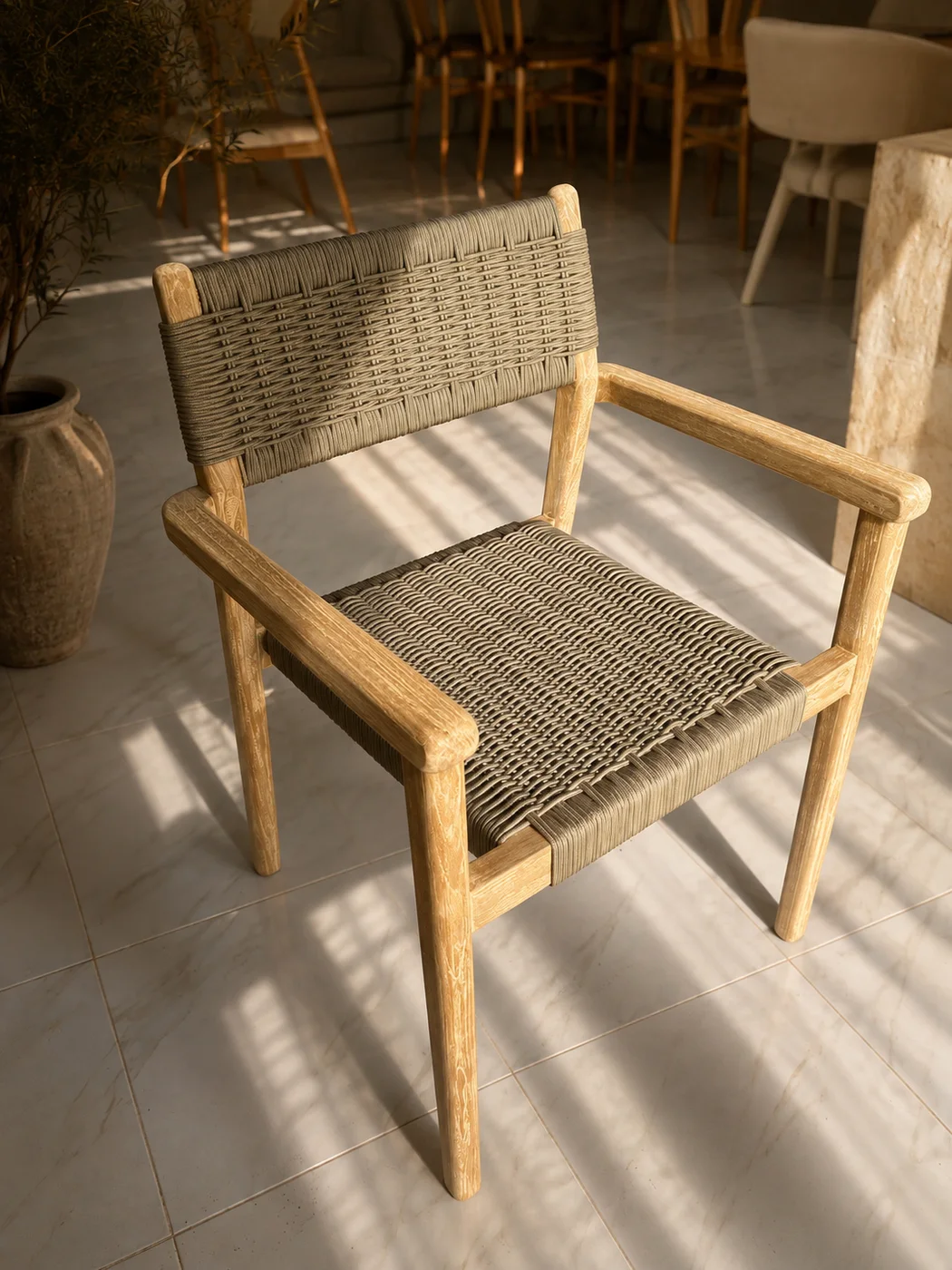 Wooden armchair with tightly woven grey-green seat and back